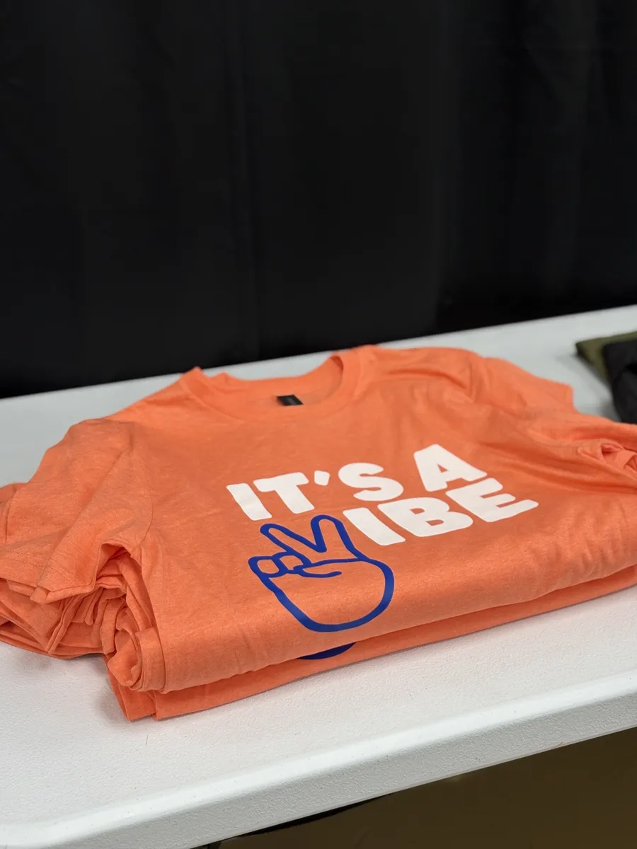 Screen printed shirts displayed for a custom apparel order